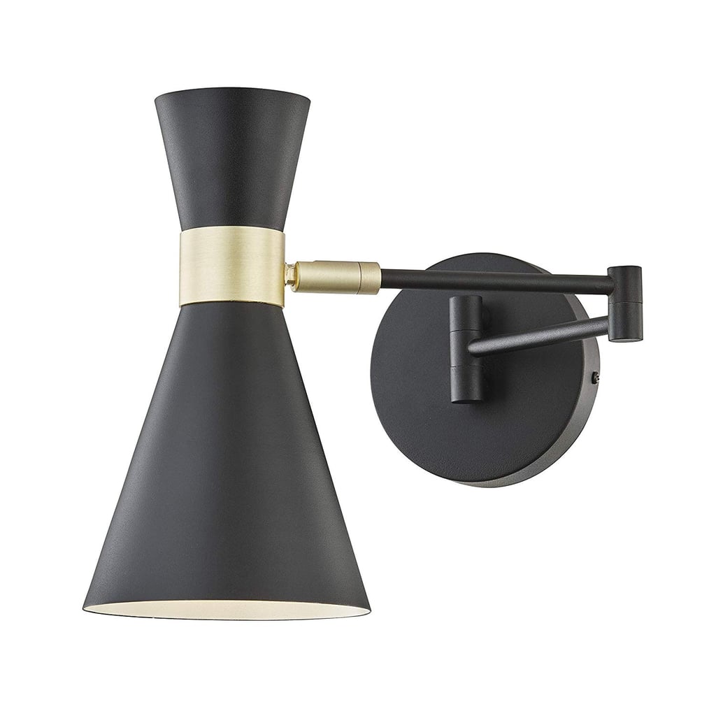 Aside from looking expensive, the sconce is also really functional with a cone shape that twists to easily focus light in any direction and an arm that can fold against the wall or fully extend. It's perfect for reading, and when you want something less bright, you can point the cone up or away from your bed for softer, indirect light.