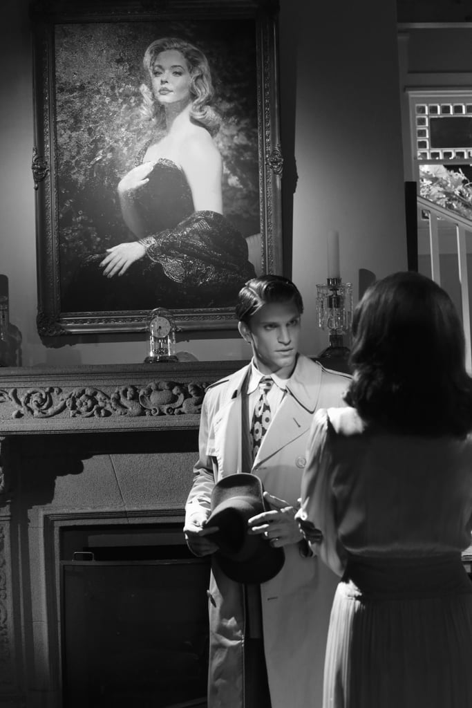 Toby and Spencer stand under a huge portrait of Alison (Sasha Pieterse).
Source: ABC Family