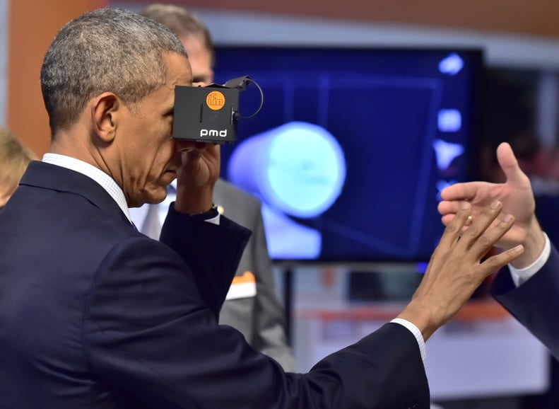 Testing out virtual reality during an official visit to Germany in 2016.
