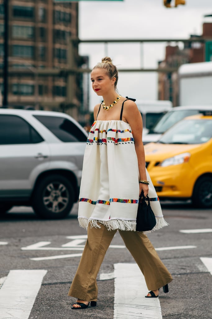 A colorful summer tunic gets a dramatic upgrade with the addition of trouser pants and a minimalist sandal — for days when it's not piping hot.