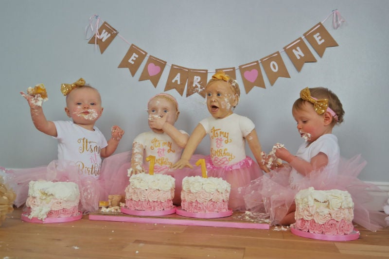 All "four" babies, enjoying their cakes.