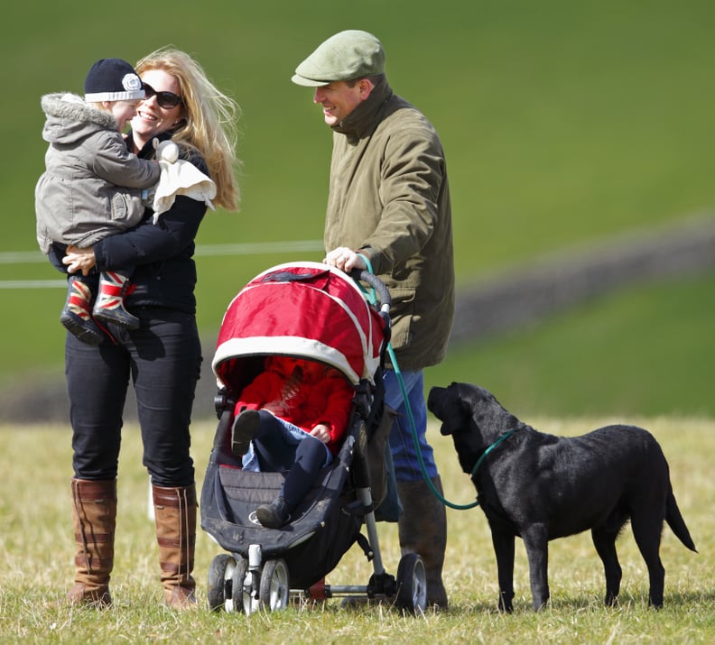 Peter, Autumn, Savannah, and Isla Phillips With the Family's Black Lab