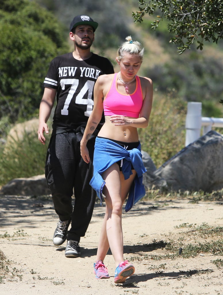 Miley Cyrus Hikes in a Pink Sports Bra