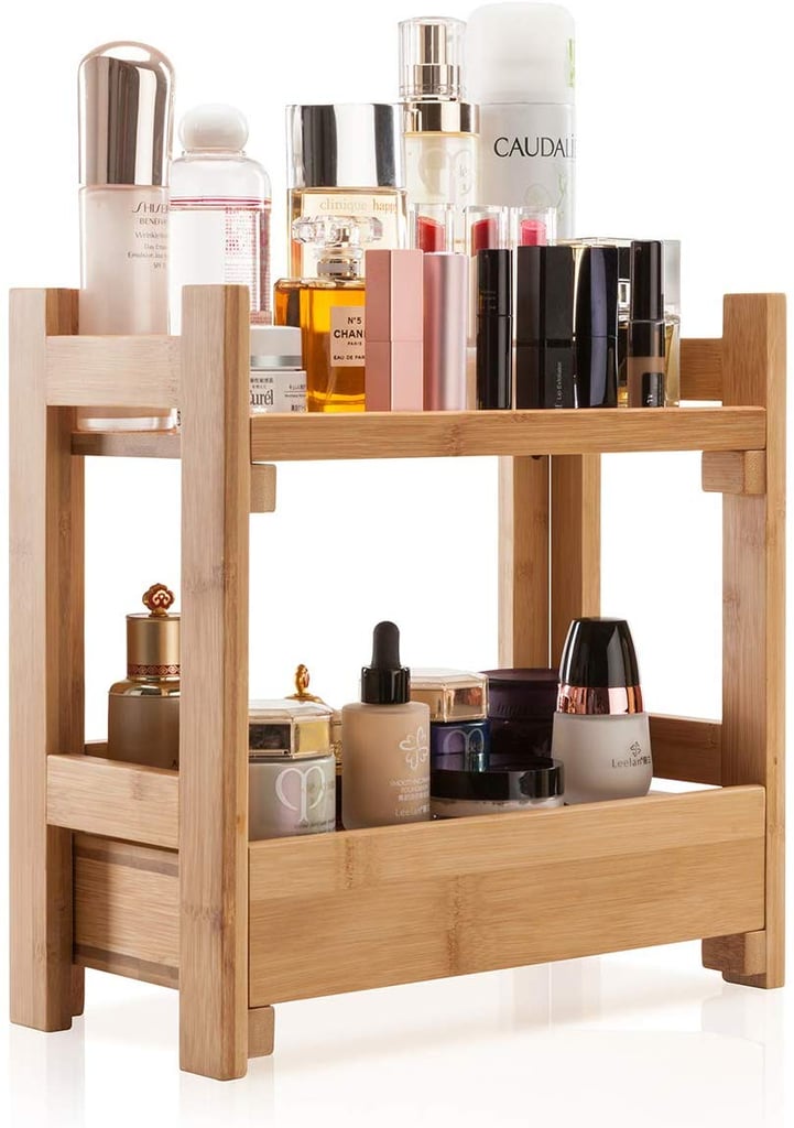 The Gobam Organiser Cosmetic Storage Holder ($46) has a natural-wood finish and can hold products on the top and bottom shelf.