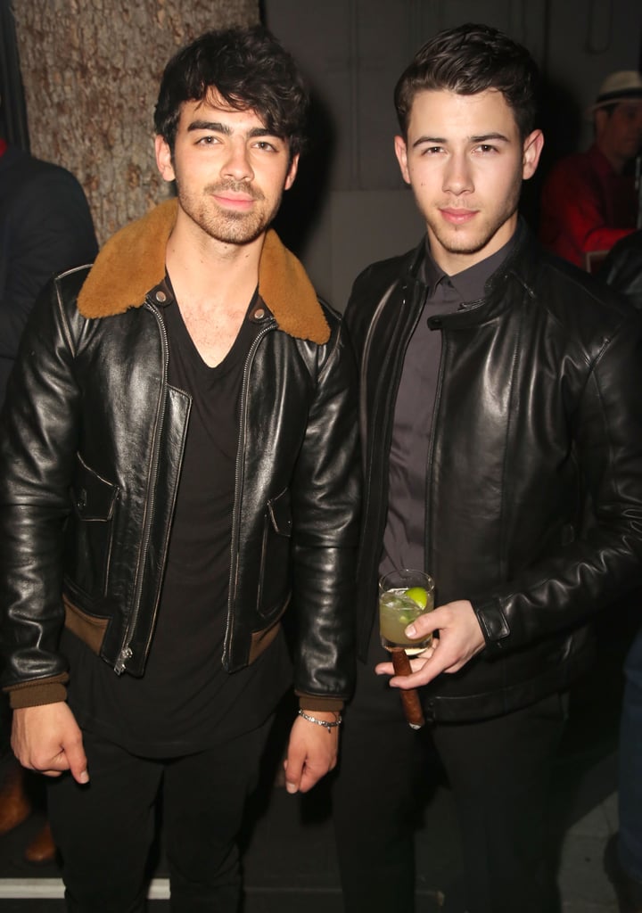Joe and Nick Jonas let loose at Zegna and GQ's bash in LA on Thursday.