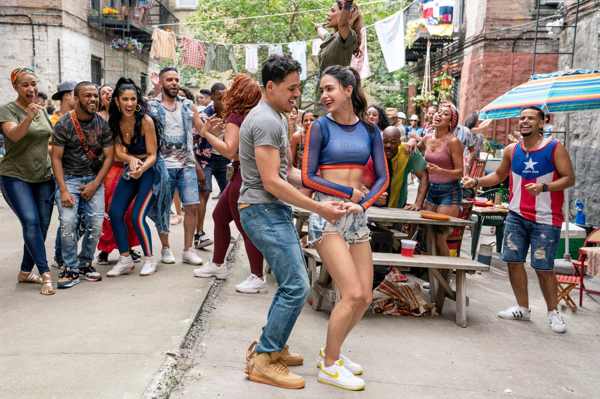 IN THE HEIGHTS, foreground from left: Anthony Ramos, Melissa Barrera, 2020.  ph: Macall Polay /  Warner Bros. / Courtesy Everett Collection