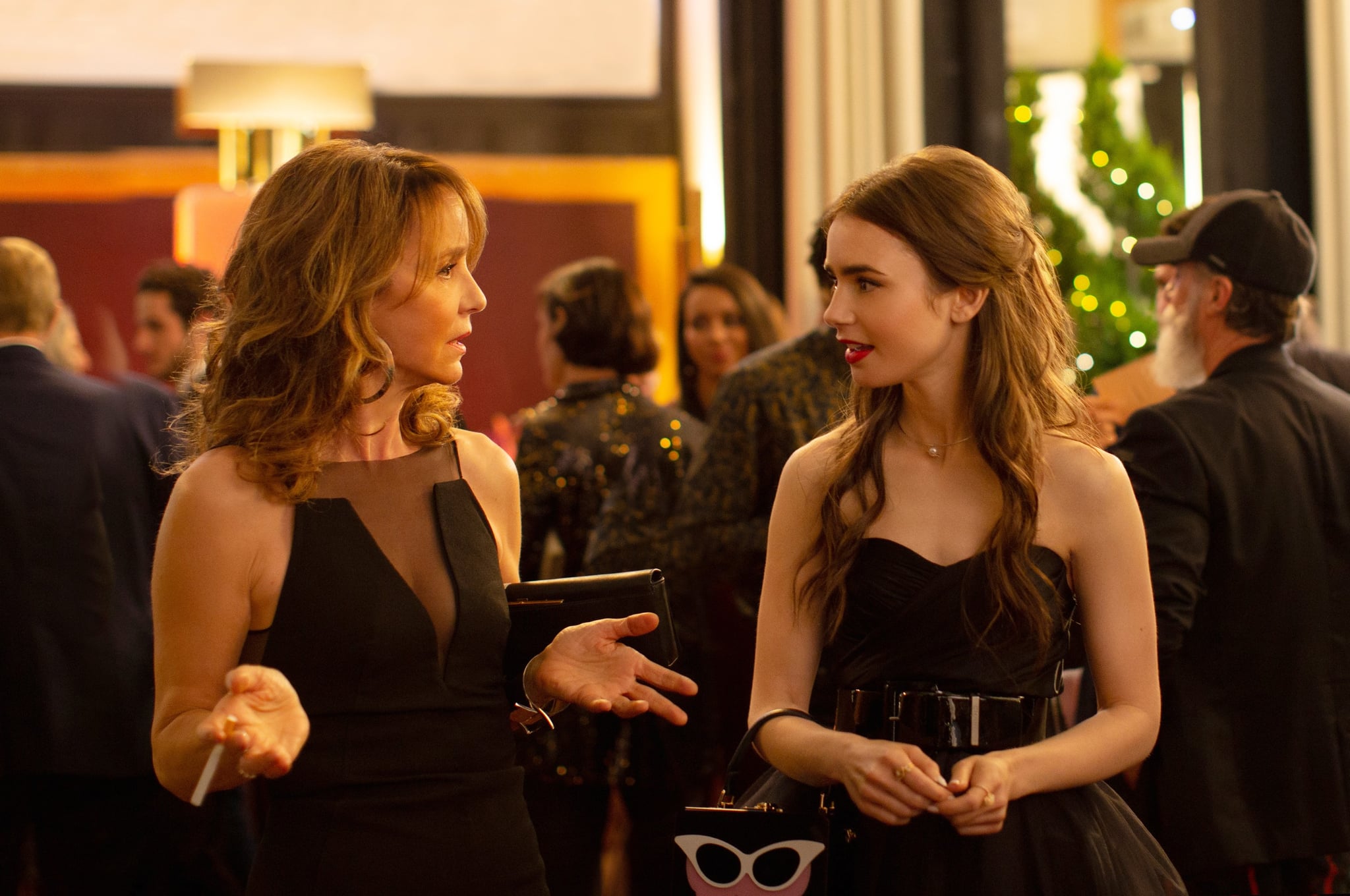 EMILY IN PARIS, from left: Philippine Leroy-Beaulieu, Lily Collins, (Season 1, ep. 102, aired Oct. 2, 2020). photo: Carole Bethuel / Netflix / Courtesy Everett Collection