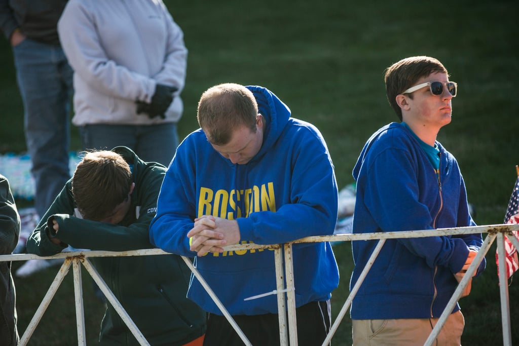 People bowed their heads for a moment of silence ahead of the race.