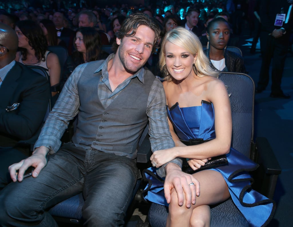 Mike placed a hand sweetly on Carrie's knee at the American Music Awards in LA in 2012.