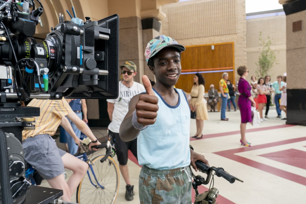 Caleb McLaughlin, in character as Lucas, flashes a thumbs up.