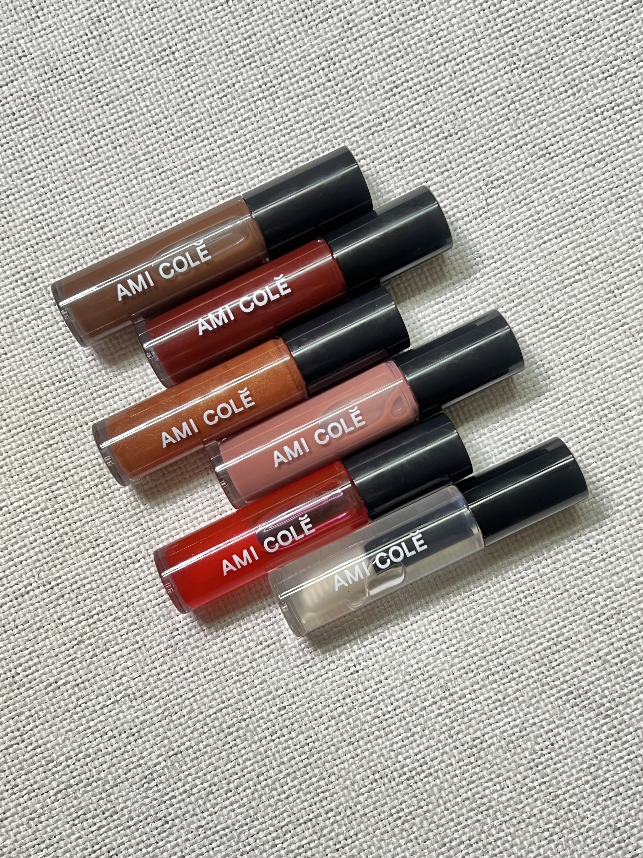 All of the shades of the Ami Colé Hydrating Lip Treatment Oil.