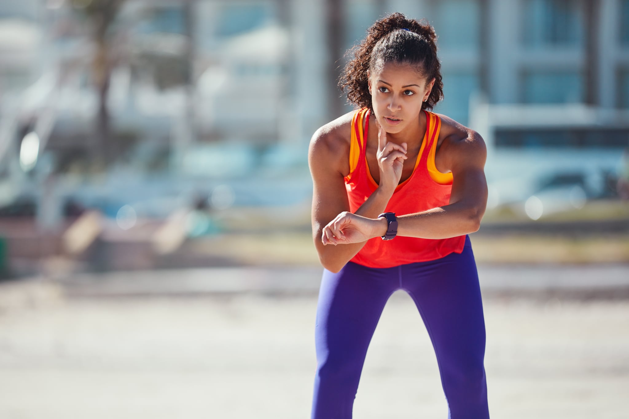 Shot of a sporty young woman measuring her pulse