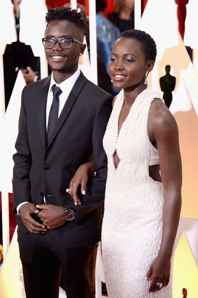 Lupita Nyong'o brought her younger brother, Peter, as her Oscars date for the second year in a row.