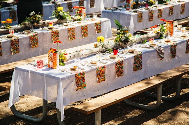 Incorporate an outdoor theme into the dining experience by using logs as table runners.
Photo by Novel Hill Studio via Green Wedding Shoes