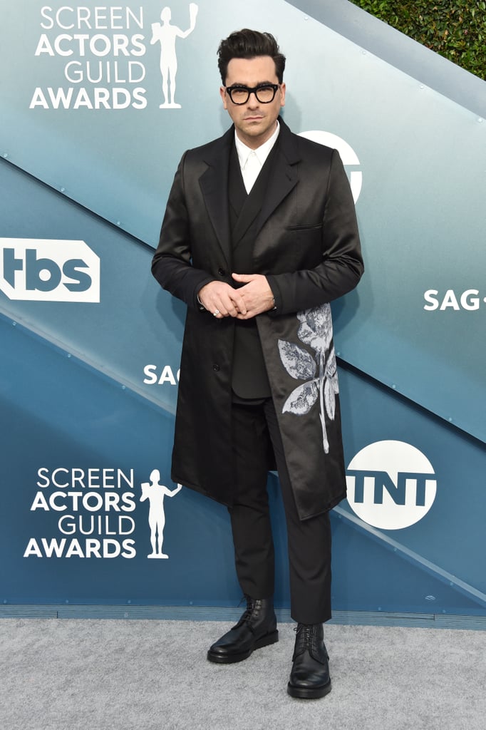 Dan Levy made a subtle, yet sweet, reference to his Schitt's Creek family during the SAG Awards on Sunday night. The 36-year-old actor wore an embroidered jacket on the red carpet that featured a beautiful rose on its left side. According to fashion journalist Booth Moore, Dan and his stylist Erica Cloud chose this Dior outerwear specifically to honor the onscreen Roses from his Pop TV show. Dan's character, David Rose, has an especially keen eye for unique clothing items, so I have a feeling he'd approve of this sentimental pick. Ahead, see more photos of Dan's carefully-chosen homage.