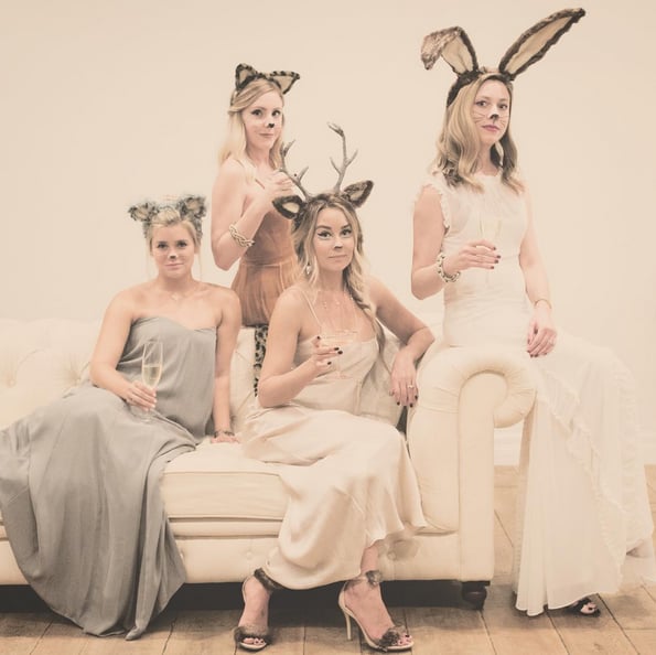 All you need to get the look are a great dress, animal ears, face paint, and a little faux fur to tape to your heels. Oh, and don't forget your cocktail and your best friends!