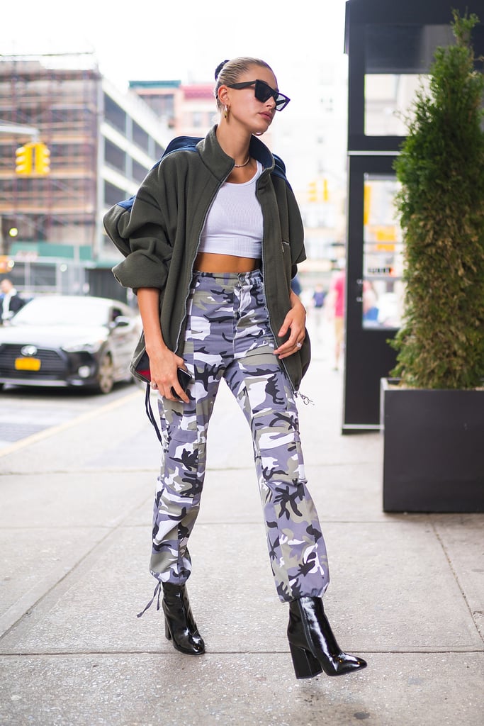 A couple of days before the Met Gala in May, Hailey stepped out in NYC wearing cargo pants, a crop top, and patent booties.