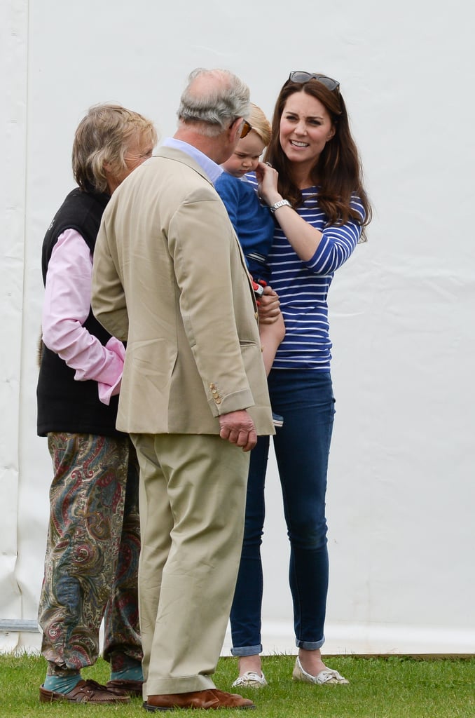 Kate smiled at her father-in-law while holding Prince George in 2015.