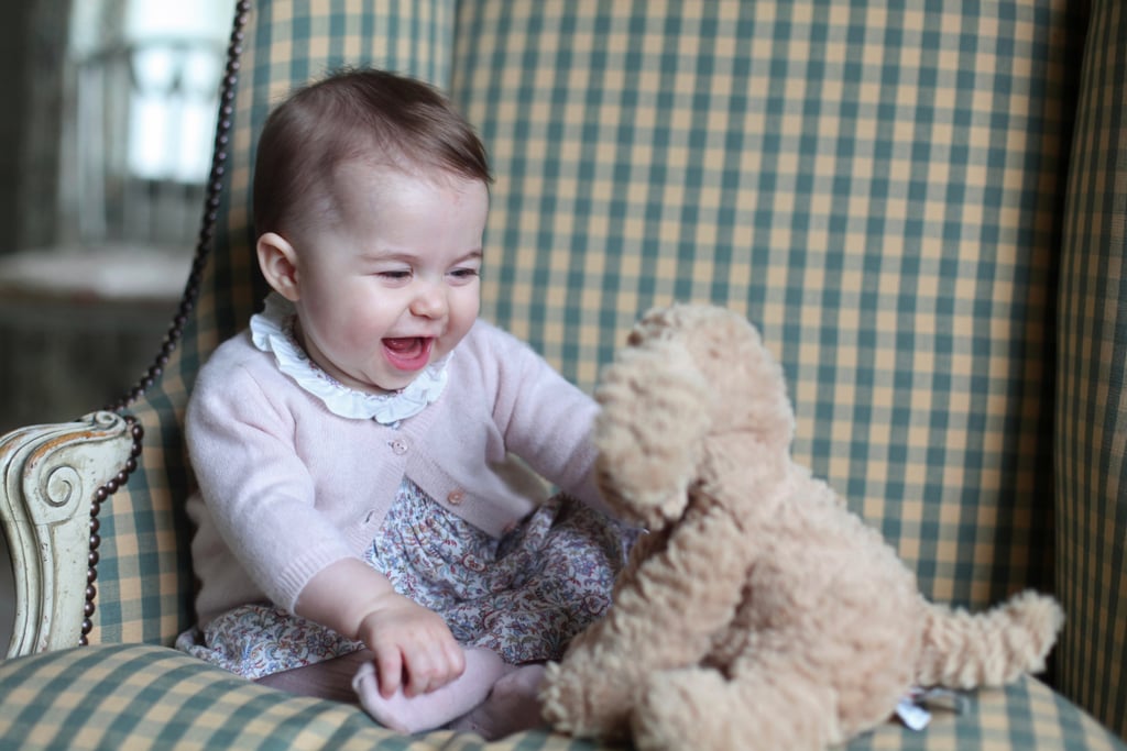 Aw! Princess Charlotte is delighted by a stuffed animal in a photo taken by proud mom Kate.
