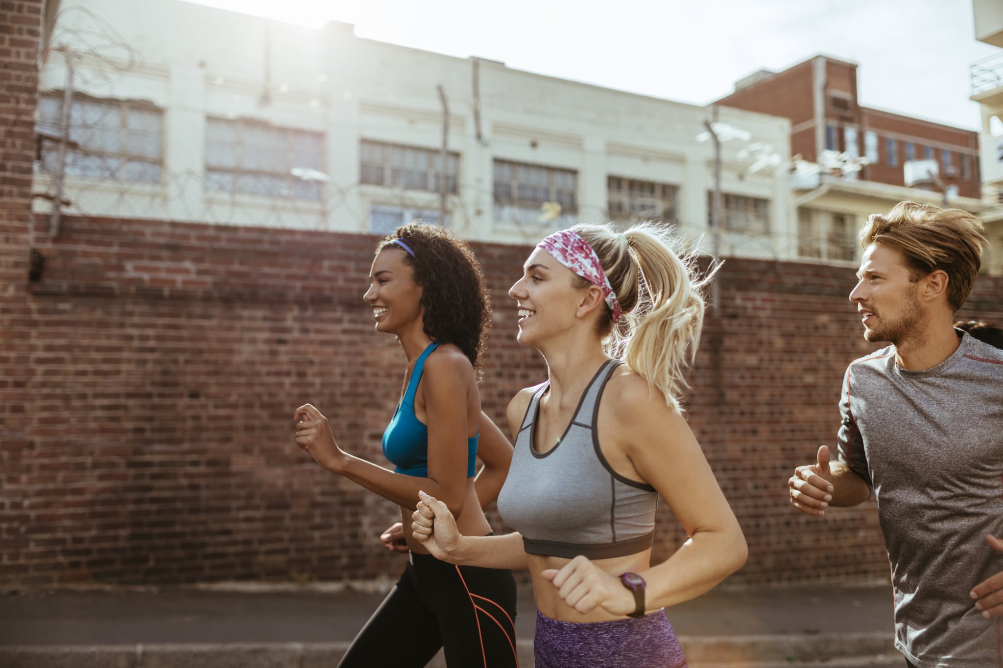 Close up of friends jogging