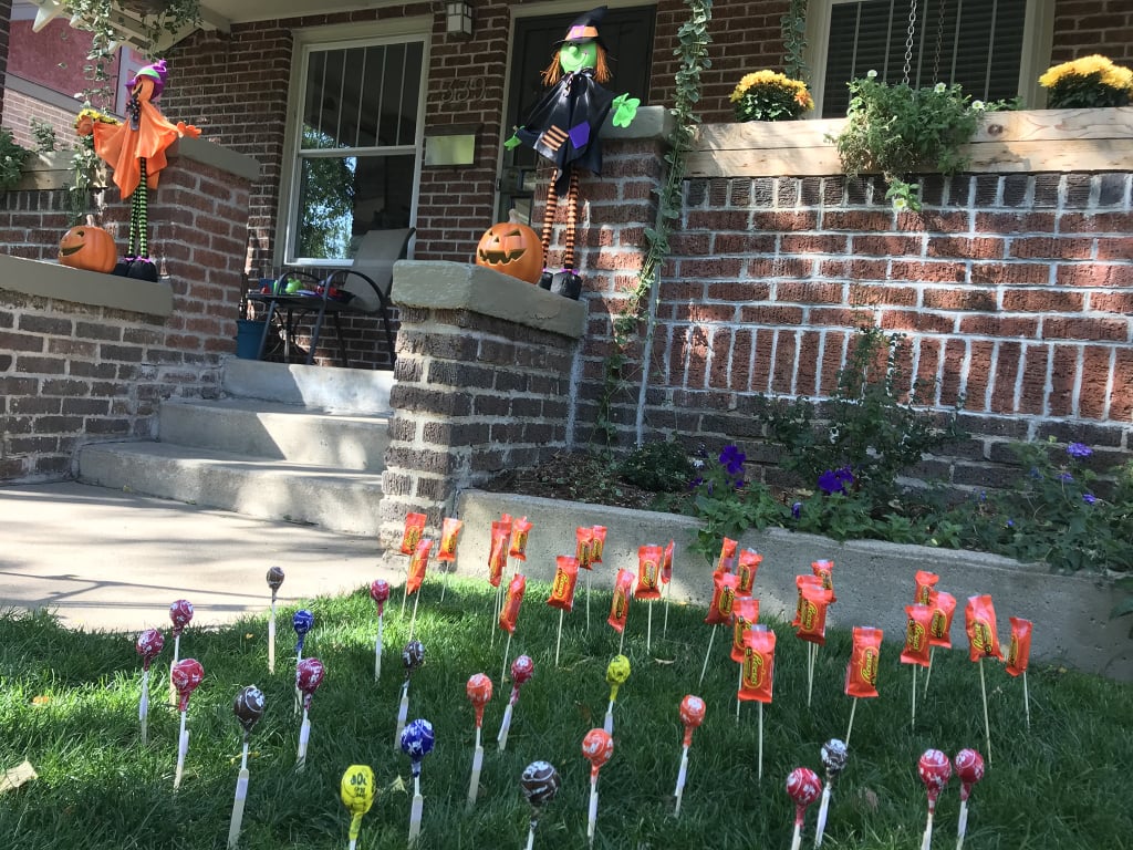 Candy Sticking Yard Idea Instead of Trick or Treating