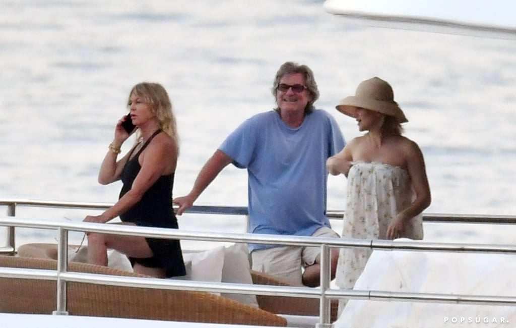 Kate Hudson and her family are living it up on vacation in Italy. The actress recently touched down in Sicily with boyfriend Danny Fujikawa, Goldie Hawn, and Kurt Russell, and they seem to be having a blast. On Tuesday, Kate — who welcomed a beautiful daughter named Rani with Danny in October — slipped into a pink bikini and enjoyed a day of yachting and kayaking in the ocean. She and Danny also snuck in a little PDA as they cuddled and kissed. Meanwhile, Goldie and Kurt appeared calm and relaxed as they explored the coast and took in the sights on their own kayak. 
Kate and Danny also squeezed in a date night when they attended the Bulgari High Jewelry Exhibition in Capri on Thursday. The following day, they returned to their yacht, where they sailed along the Amalfi coast with Kate's parents. Goldie and Kurt also seemed to be enjoying themselves as they went for a dip in the ocean and rode jet skis.
Kate and Danny first began dating in December 2016 after being friends for 14 years. Earlier this week, the 40-year-old actress praised her other half in a loving Instagram tribute for his 33rd birthday. "This man has given me the most beautiful gifts life can give and the depth of gratitude I feel for the day he was born is beyond any measured spoken word or post," she wrote. "Thank you Mama Fuj and Papa Fuj for raising this beautiful roller coaster ride of a special human. The ups and downs and sideways were all worth it." Aw! While baby Rani is Kate and Danny's first child together, the actress also has two sons, 15-year-old Ryder Robinson and 7-year-old Bingham Bellamy, from her previous relationships with The Black Crowes' Chris Robinson and Muse frontman Matthew Bellamy. Keep reading to see more of Kate's adventure-filled family vacation! 

    Related:

            
            
                                    
                            

            Kurt Russell and Goldie Hawn&apos;s Modern Family Is Absolutely Golden