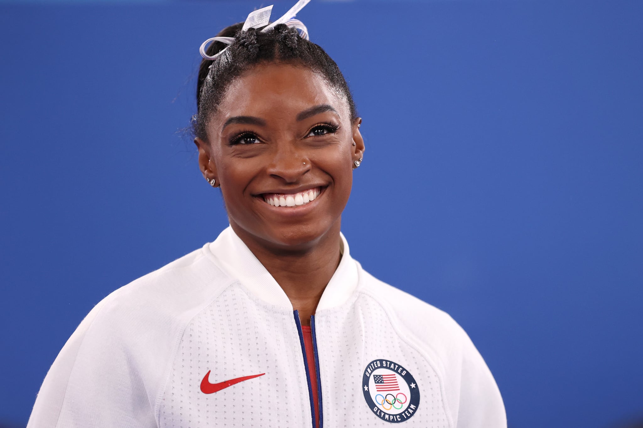 TOKYO, JAPAN - JULY 27: Simone Biles of Team United States smiles during the Women's Team Final on day four of the Tokyo 2020 Olympic Games at Ariake Gymnastics Centre on July 27, 2021 in Tokyo, Japan. (Photo by Laurence Griffiths/Getty Images)