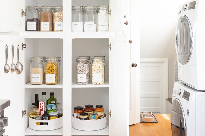 an organized kitchen cabinet stocked with snacks