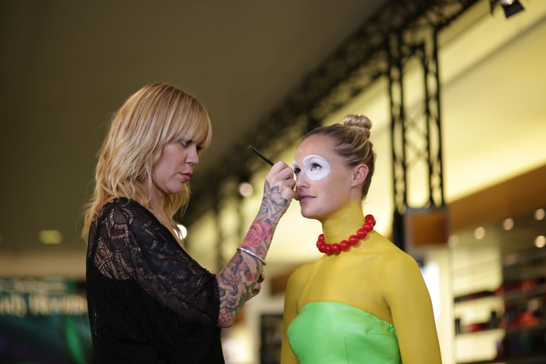 Caroline Donnelly applies water-based paint to her model