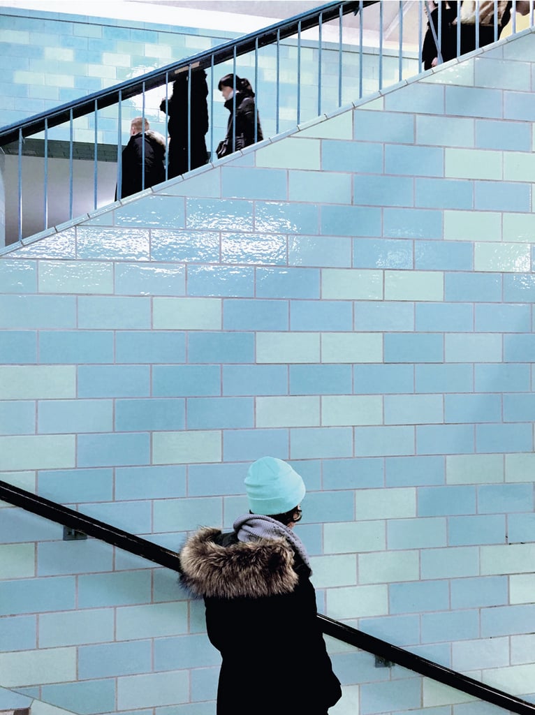"Different elements that share a similar color palette, like the blues of the tile and the winter hat, can help tie a composition together."