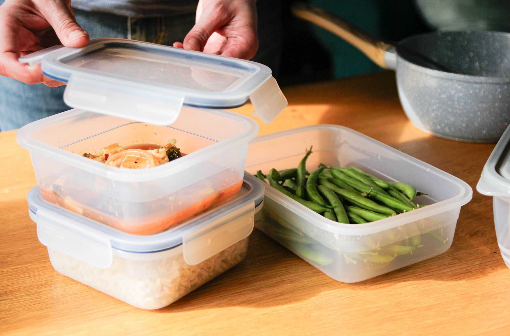 Woman's hands packing up leftover Thanksgiving food. Leftover turkey will last in the freezer for up to three months.