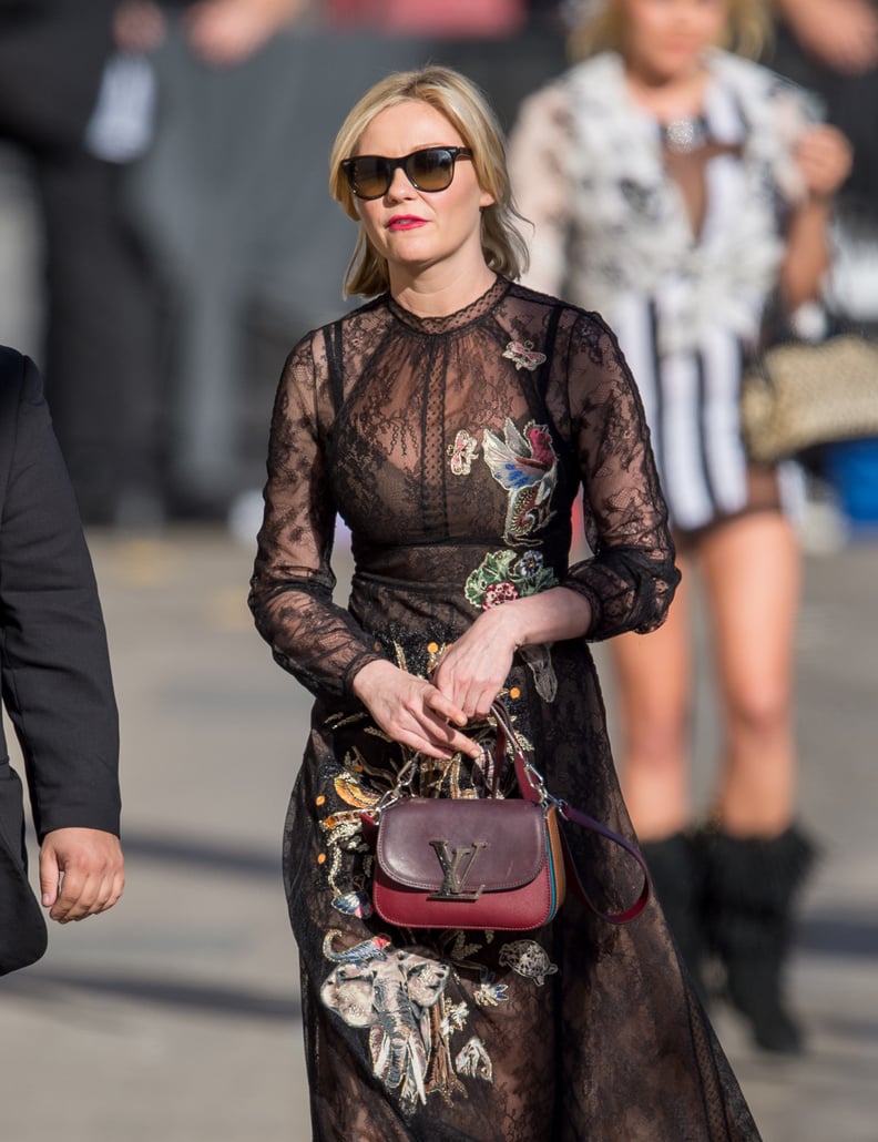 Kirsten Paired Her Black Embroidered Dress With a Colorful Purse