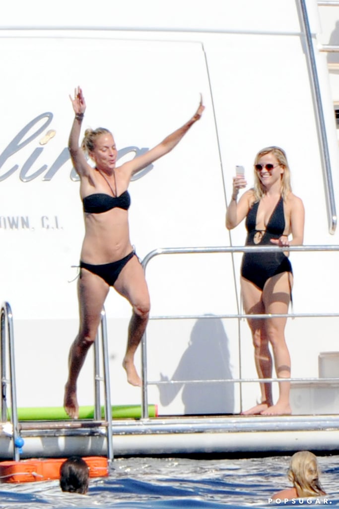 Reese Witherspoon let loose with pals in her tight black bikini in Italy.
