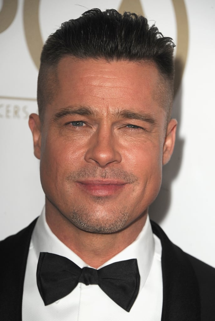 Brad Pitt wore his hair perfectly combed back.
