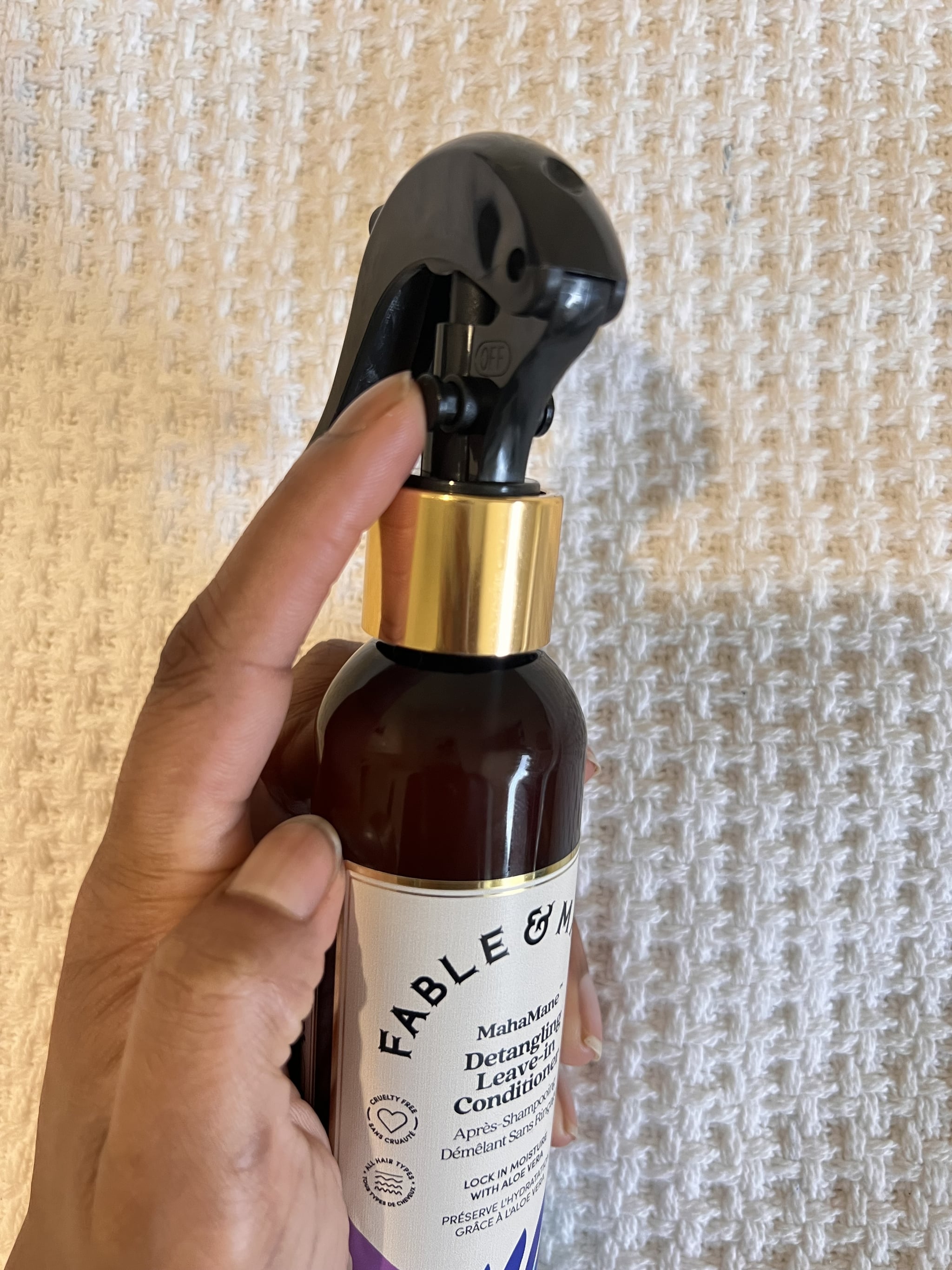 The spray lock of the Fable and Mane Mahamane Detangling Leave-In Conditioner bottle.