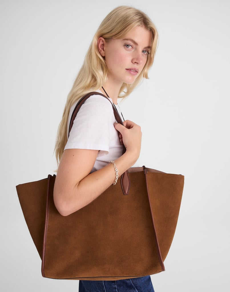 Madewell The Lexington Oversized Tote ($228)
Madewell is that girl. It just gets it, and I fully appreciate it. All of its releases this year have been top-notch (I love the brand's jeans), and this tote bag is no exception. While I don't personally own it, I've visited it in-store regularly, and I know it's on my list of purchases soon. I like to look chic while going to a coffee shop to get some work done, and this bag definitely helps me do that. It would fit my laptop, phone, keys, wallet, and headphones — all while looking top-notch. Tote bags are always a good gift (psst, mom and dad) — especially when they're as stylish as this one.
