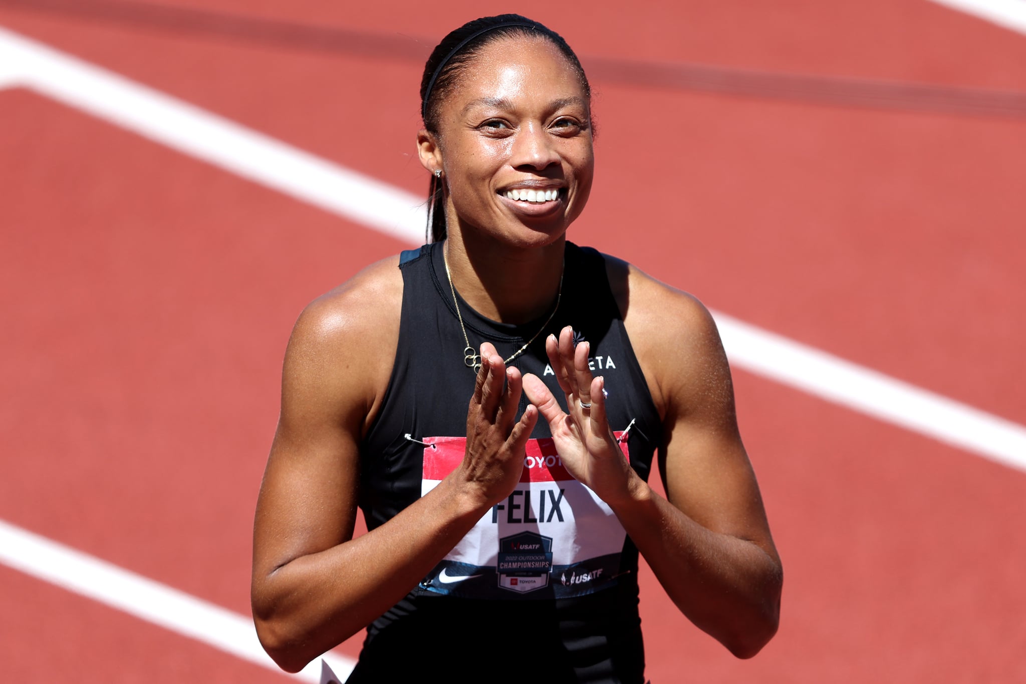EUGENE, OREGON - JUNE 24: Allyson Felix acknowledges the crowd after competing in the women's 400 meter dash final during the USATF Championships at Hayward Field on June 24, 2022 in Eugene, Oregon. (Photo by Sean M. Haffey/Getty Images)