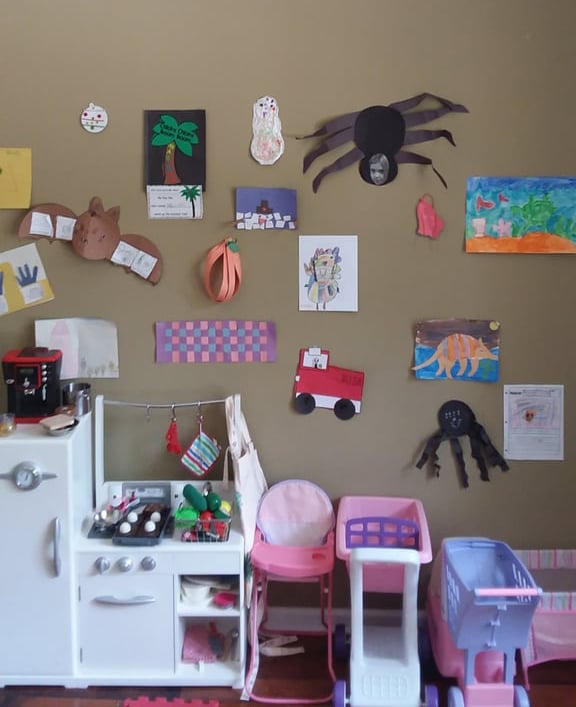 I displayed their artwork on our playroom walls with double-sided tape.