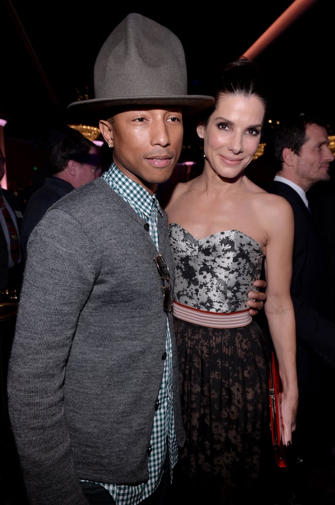 Pharrell and Sandra Bullock posed together at the Oscars Nominees Luncheon, and his hat photobombed them at the last second!