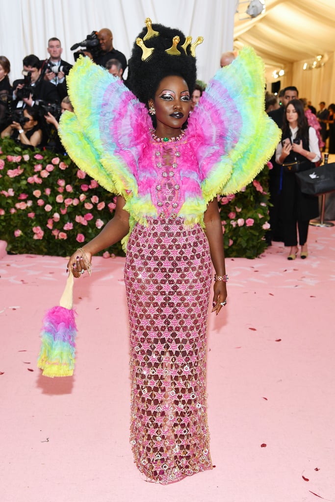 So Camp: Lupita Nyong'o in an Exaggerated Rainbow With Drag-Inspired Makeup and Afro Picks