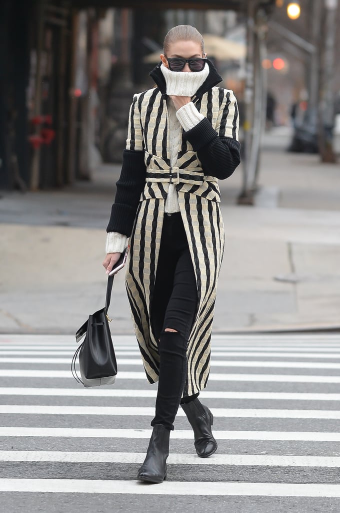 Gigi Hadid pulled up her turtleneck for warmth during a windy day in NYC.