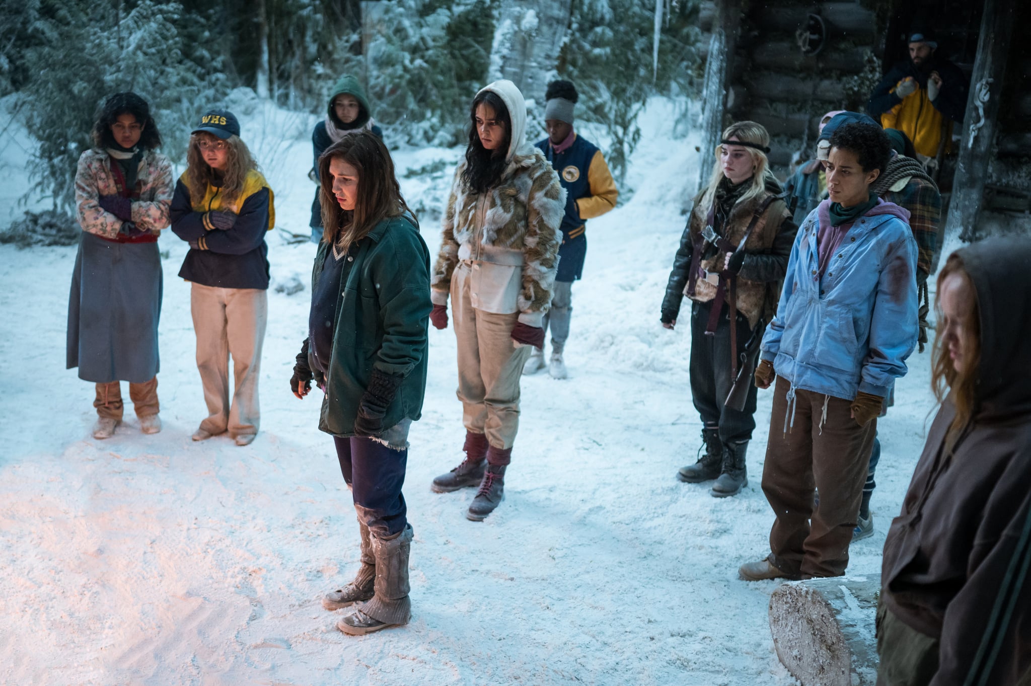 (L-R): Nuha Jes Izman as Teen Crystal, Samantha Hanratty as Teen Misty, Alexa Barajas as Teen Mari, Sophie Nélisse as Teen Shauna, Courtney Eaton as Teen Lottie, Nia Sondaya as Teen Akilah, Sophie Thatcher as Teen Natalie, Jasmin Savoy Brown as Teen Taissa, Steven Krueger as Ben Scott and Liv Hewson as Teen Van in YELLOWJACKETS, Season 2. Photo Credit: Kailey Schwerman/SHOWTIME.