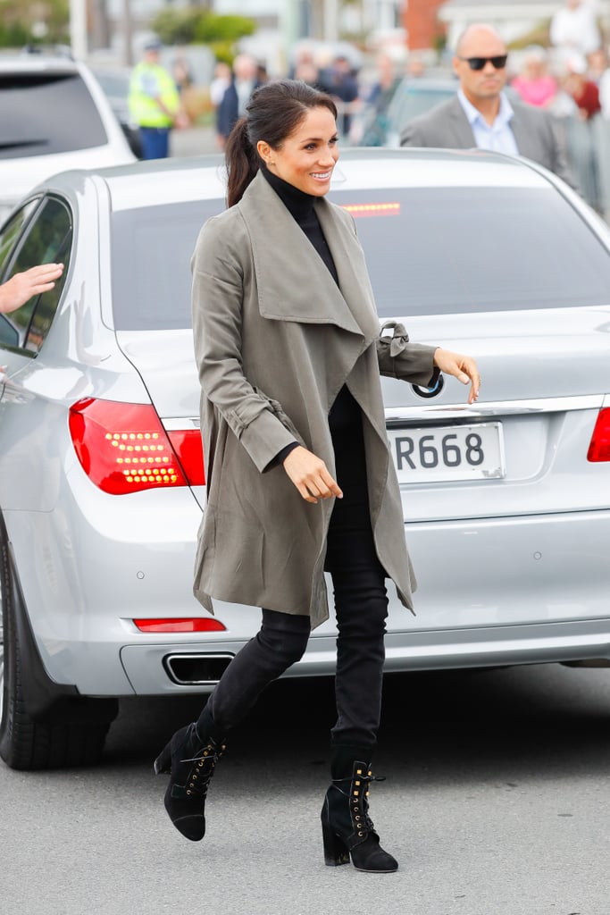 Meghan's fifth and final appearance in Outland Denim happened in New Zealand. This time around, she paired her black jeans with a Club Monaco trench and Stuart Weitzman lace-up boots.