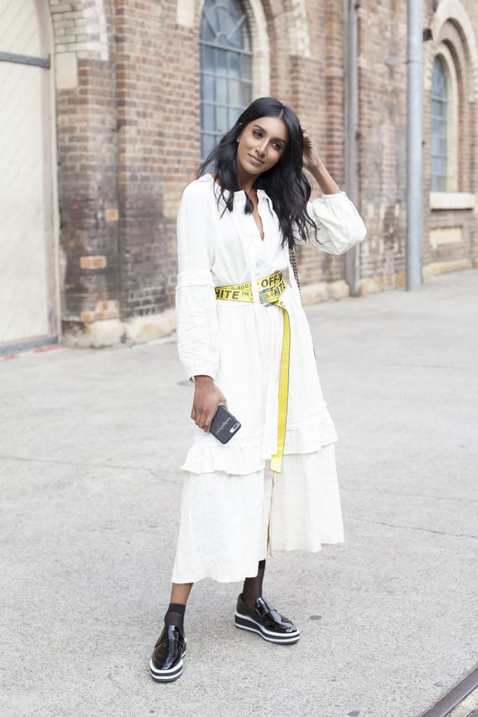 Make an unexpected statement by looping a loud, vibrant belt around ladylike Summer separates.