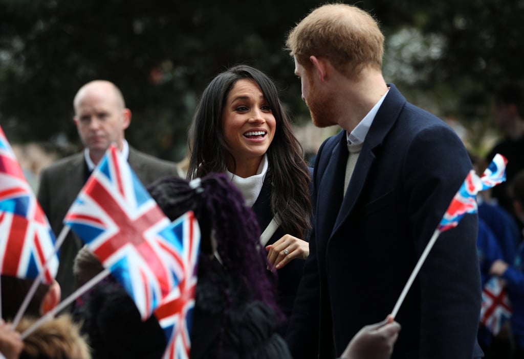 Meghan Markle Looking at Prince Harry Pictures