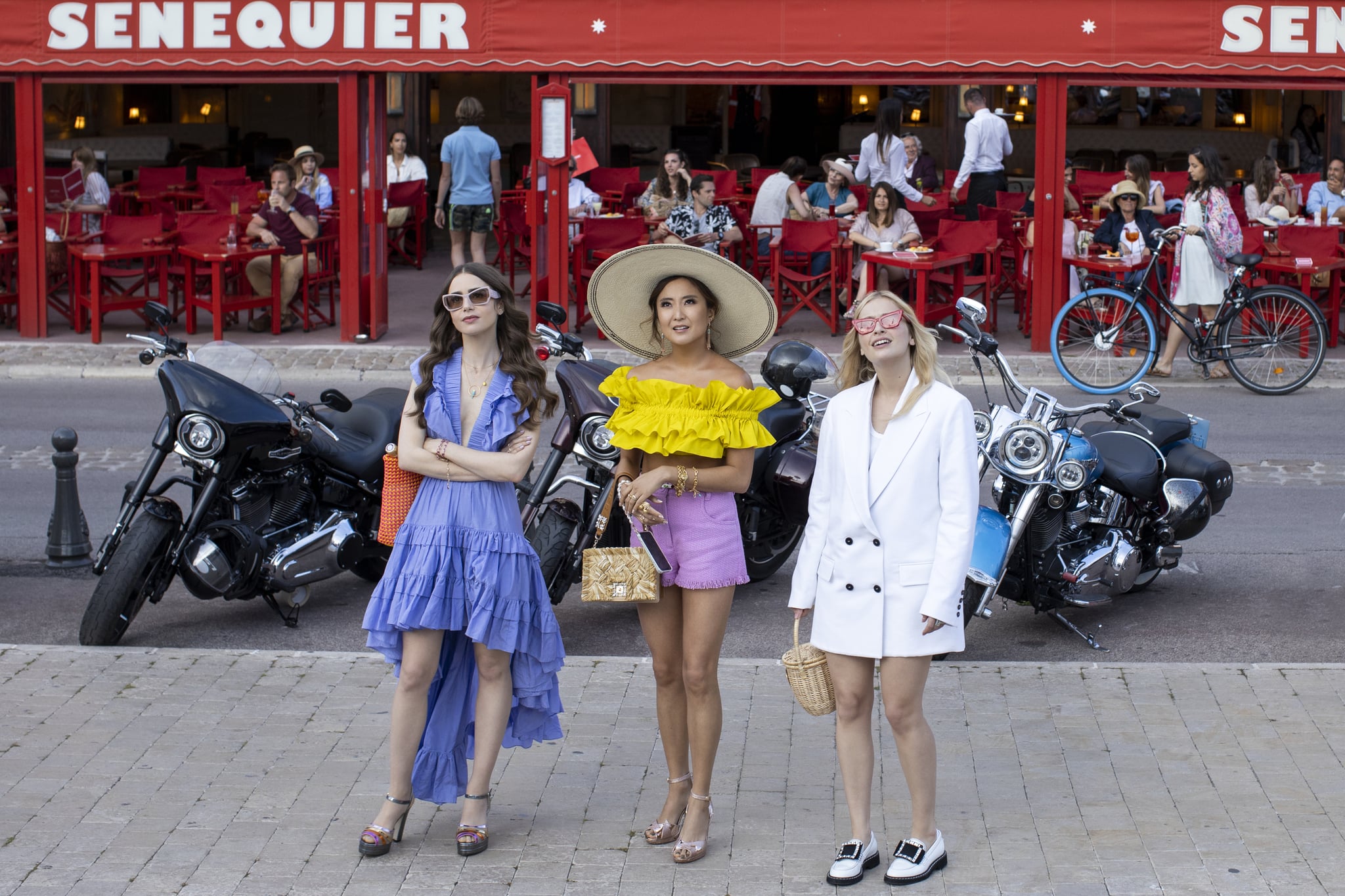 Emily in Paris. (L to R) Lily Collins as Emily, Ashley Park as Mindy, Camille Razat as Camille in episode 202 of Emily in Paris. Cr. Carole Bethuel/Netflix © 2021