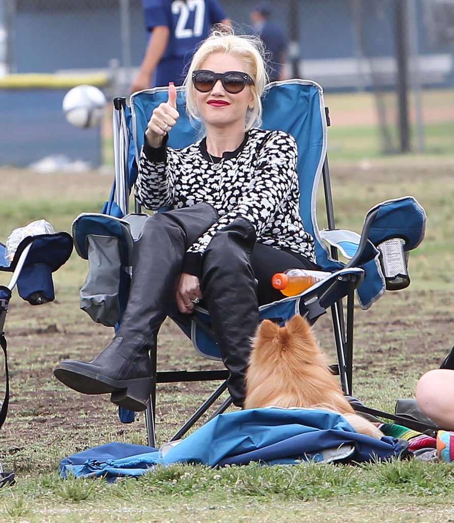 Back in September, Gwen sat stylishly on the sidelines to watch her son's soccer game in a printed sweater, leggings, and knee-high boots. She completed her carefree look with a pair of shades.