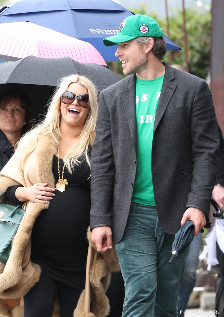 Jessica Simpson laughed as she walked arm in arm with fiancé (and the festively dressed) Eric Johnson in LA in March 2012.