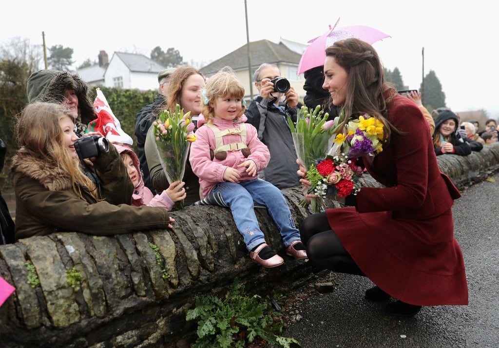 Is it just us, or does Kate Middleton get more and more lovable by the day? The charitable royal journeyed to Caerphilly, Wales on Wednesday for a visit with the Caerphilly Family Intervention Team (FIT), where she not only proved she's quite the pool shark, but also racked up some adorable photo ops. The organization, which works with children who have emotional and behavioral problems, received the duchess with open arms, greeting her with multiple bouquets of flowers and challenging her to a game of pool. She posed for photos with a large group of FIT members, including one little girl who couldn't resist giving Kate a warm hug. Although this is only one of many patronages that Kate is involved with, it might be her cutest yet.

    Related:

            
                            
                    34 Snaps of Kate Middleton With Little Girls That Are Sure to Make Your Heart Explode
                
                            
                    Kate Middleton Shows Off Her Competitive Spirit at a Charity Race With William and Harry