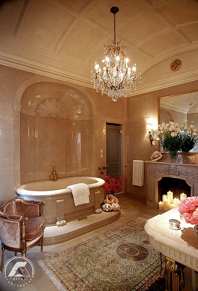 With its free-standing tub, chandelier, and marble walls, this bathroom takes glamorous to a new level!